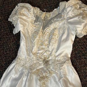 Custom MadeHigh End Wedding Dress with Emerald beads long tail that flairs out